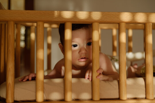 Baby in a cot at home