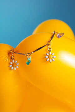 Charm chain on yellow balloon