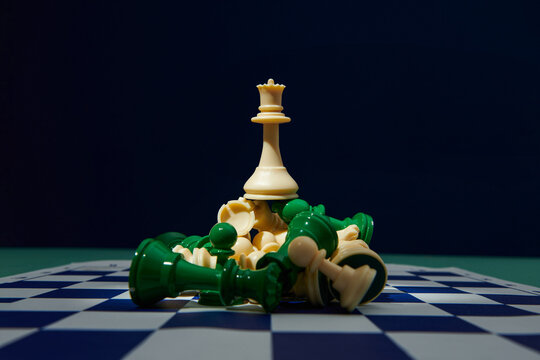 Chess on a chessboard at black background, Business leader