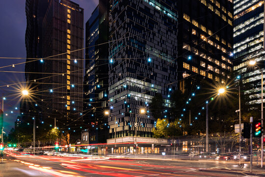 buildings in the city of Melbourne during a night with cars lights
