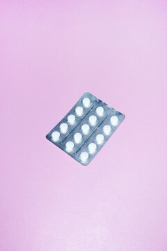 White omega/vitamin pills/tablets with hard direct flashlight