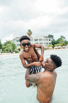 I love it when my dad lifts me out of the water and throws me 