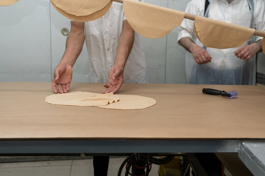 Perforating Shmura Matzah Before Baking.