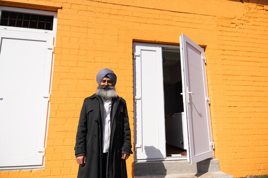 Indian Owner Portrait In Front Of His Business