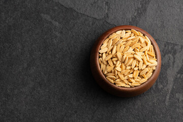 Risoni, uncooked pasta - Organic dried orzo in the bowl
