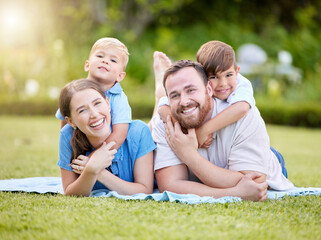 Smile, relax and portrait of family in nature with hug, love and care for bonding together. Happy,...