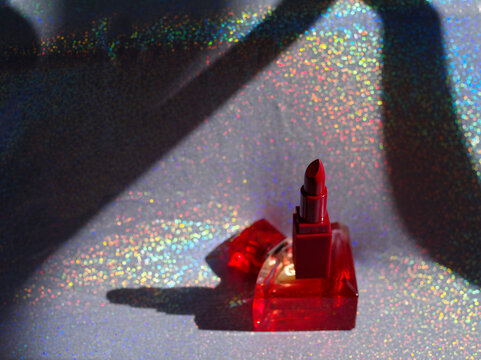 perfume and lipstick still life