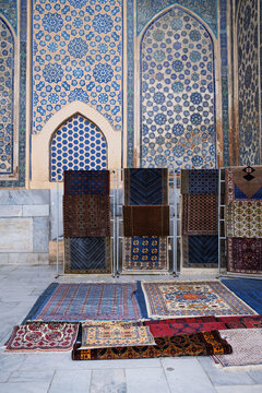  Persian Carpets Displayed Against the Tile Work of an Uzbek mosque