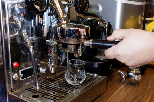 barista preparing coffee in coffee maker