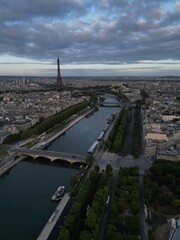 Aerial view of Eiffel Tower at sunrise, along with views of the Seine river in Paris, France