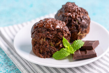 Chocolate muffins with zucchini close-up.