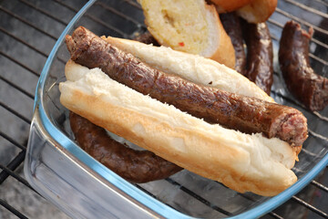 grilled sausages on the grill. Boerewors sausage roll