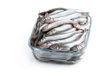Fresh raw european smelt in a glass bowl isolated on white