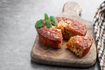 Oat and almond pie on gray background