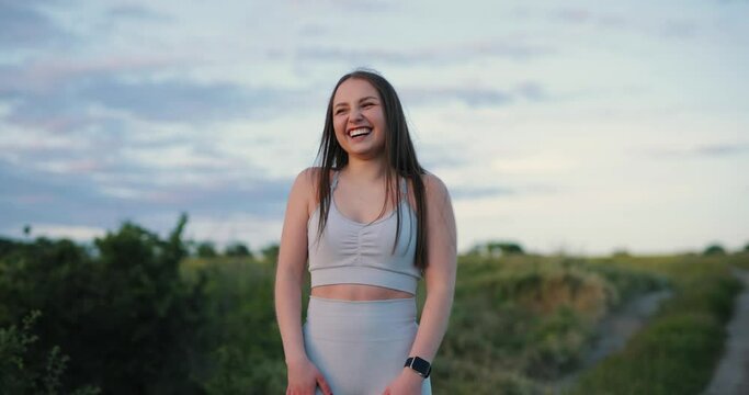 Happy smiling giggling woman at the nature, slow motion