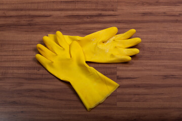 Pair of yellow rubber washing cleaning gloves