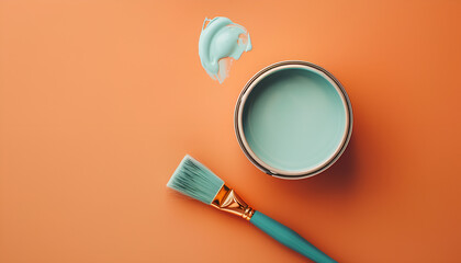 Can with light blue paint, brush and color palette on orange background, flat lay