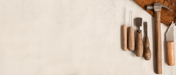 Craft tools for work with leather on light background