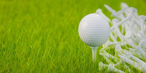 A golf ball on a golf tee on a lawn. Several tees in the grass. Selective focus - very shallow depth of field. Copy space.