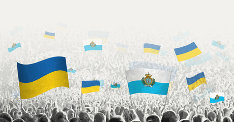 People waving flag of San Marino and Ukraine, symbolizing San Marino solidarity for Ukraine.