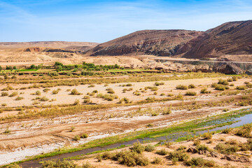River in oasis of Ksar Ait Ben Haddou, old Berber ancient village or kasbah, Ouarzazate, Morocco,...