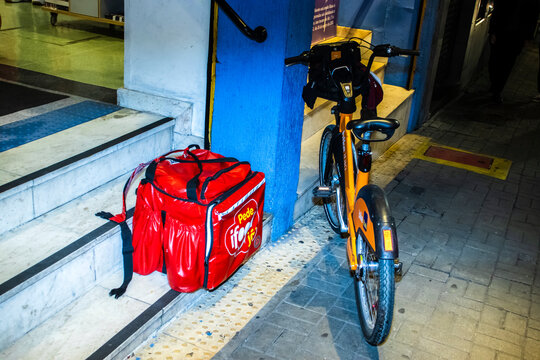 Sao Paulo, Brazil, May 18, 2024. Motorcycle parked with a Styrofoam box for transporting food from the company ifood, on a street in downtown of Sao Paulo
