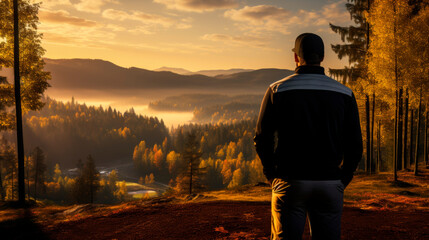 Fototapeta premium A male sports manager in a suit stands with his back looking at the sports field. Concept: Reflections and success, business and ambitions, sports leadership, motivation.