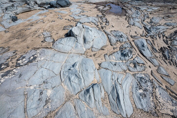 Closeup of light gray lava rock flow at Makalua-Puna Point, Maui, Hawaii, as a textured nature background.
