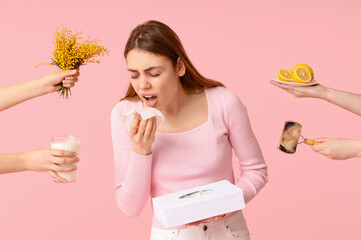 People giving mimosa, plate with lemon, brush with fur and glass of milk to young woman suffering...