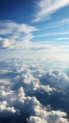 A tranquil scene of boundless white clouds with the gentle touch of blue sky