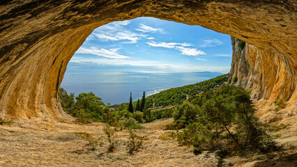Spectacular cave in the mountainside with a beautiful view of the Adriatic Sea. Exploring and...
