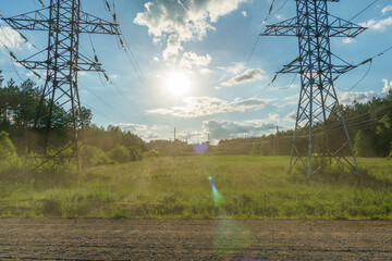 Power lines in an agricultural field. The support of an overhead power line in a wheat field...