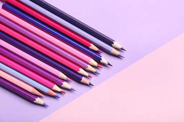 Obraz premium Art and craft supplies, colorful pencils on a two-tone background, creativity and education concept