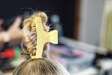 create a fashionable ponytail hairstyle for a ballroom dancing tournament. Non-Olympic sport