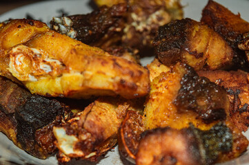 dry-fried fish pieces served on a white plate