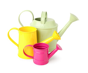 Different watering cans on white background