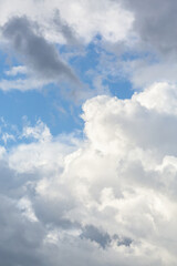 White fluffy clouds in blue sky, perfect for weather forecast background or nature-inspired design projects