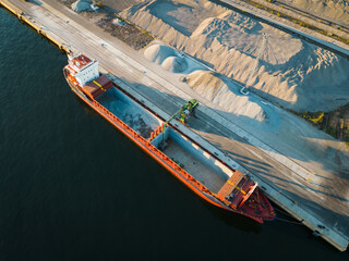 Loading of a dry cargo vessel in the port of Muuga, drone aerial photo.