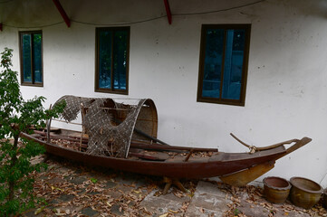 Closeup of The Rua Mard Pratoon Boat, Ancient Wooden Thai Boat with a decaying bamboo roof on the...