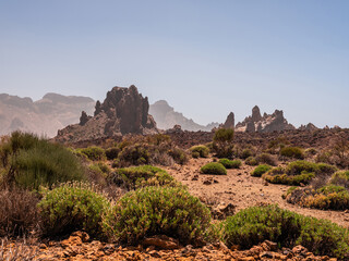 spot in Tenerife with many red rocks and beautiful mountain landscape background