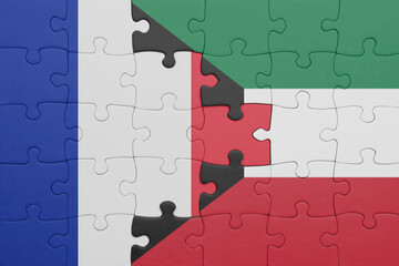 puzzle with the colourful national flag of kuwait and flag of france.