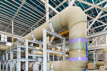 Water pipes and pumps at a reverse osmosis desalination plant.