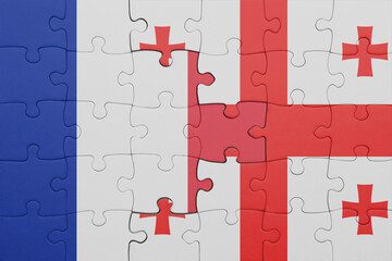 puzzle with the colourful national flag of georgia and flag of france.