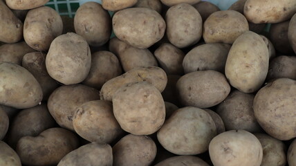 potatoes on the market in containers