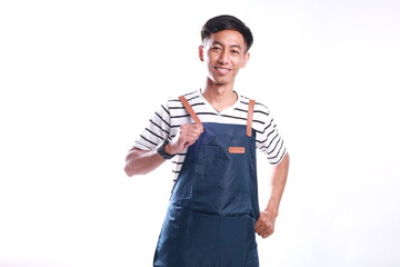 Asian Man wearing Apron in casual stylish clothing, standing upright pose while wearing and tidying...