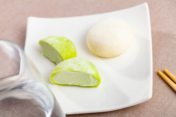 Japanese cake known as mochi or ice cream with rice on white plate