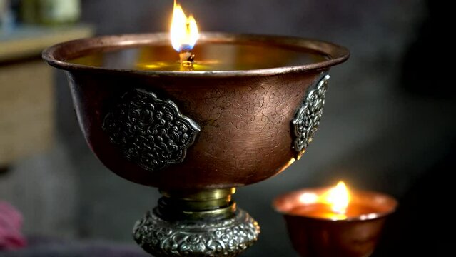 Burning lamp in a Buddhist temple in the Himalayas