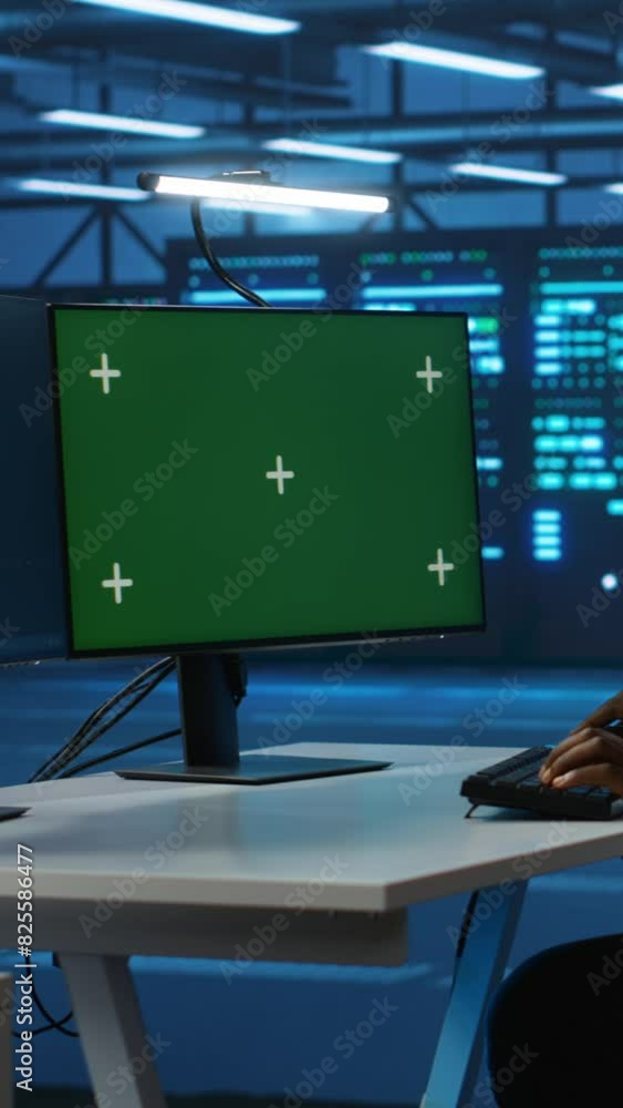 Poster vertical video technician upgrading equipment in data center using isolated screen display. professi