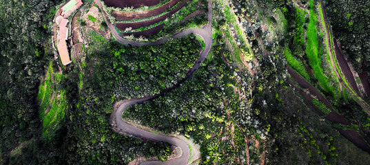 A landscape with a road and valleys among the mountains at sunset, the way to the Masca Gorge, Tenerife island.