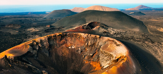 A beautiful view of a volcano crater, desert, mountains and volcanoes on the Lanzarote island. © Zhanna